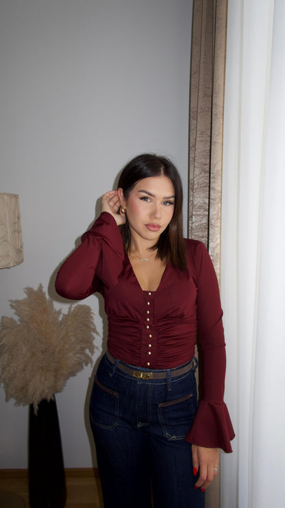 Body with gold buttons